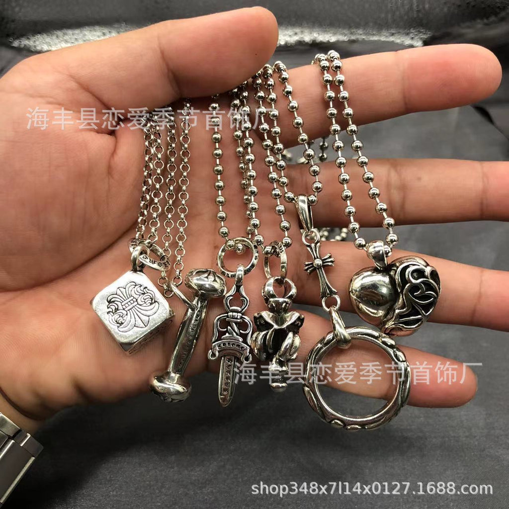 Chrome Hearts heart-shaped sword cross pendant